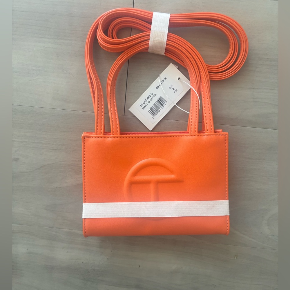 Orange Small Telfar never worn Noted in picture the corner was slightly damaged